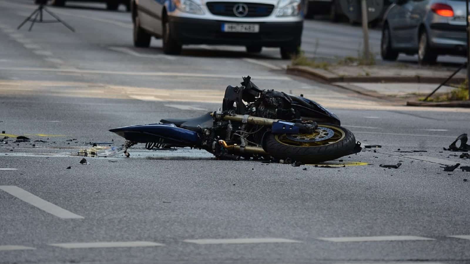 Crashed Motorcycle Laying In The Street Stock Photo