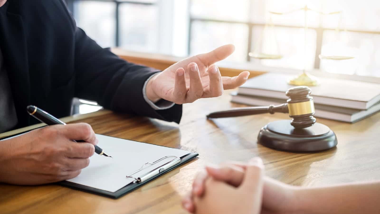 Male Lawyer Consulting A Client Stock Photo