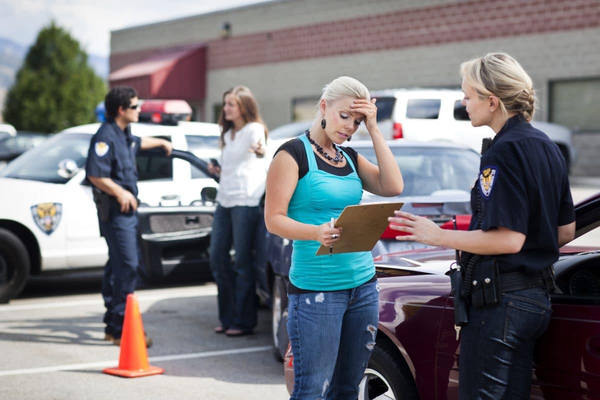 A woman filing a police report after an accident