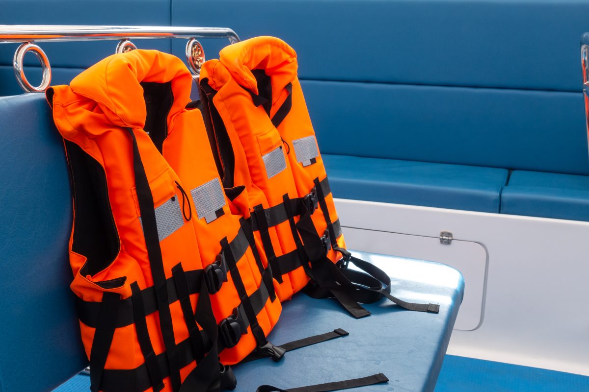 Two personal flotation devices (PFDs) are seen on a boat, indicating safe boating practices by the operator.