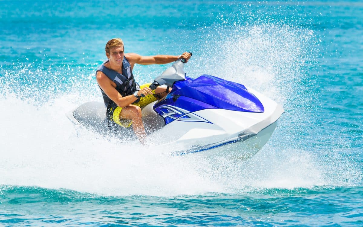 Young Man Riding a Jet Ski on a Sunny Day